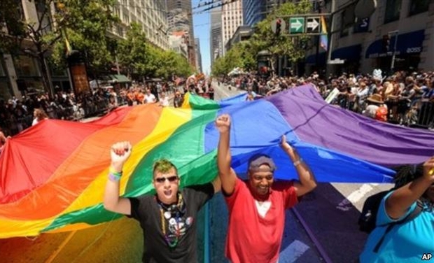 Mark Wilson, right, helps carry a rainbow flag during San Francisco's 42nd annual Gay Pride parade on June 24, 2012. (Photo: AP) Mark Wilson, right, helps carry a rainbow flag during San Francisco's 42nd annual Gay Pride parade on June 24, 2012. (Photo: AP)
